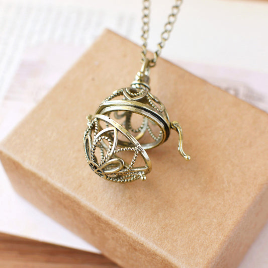 Retro Artistic Hollowed-out Sachet Ball Pendant Necklace