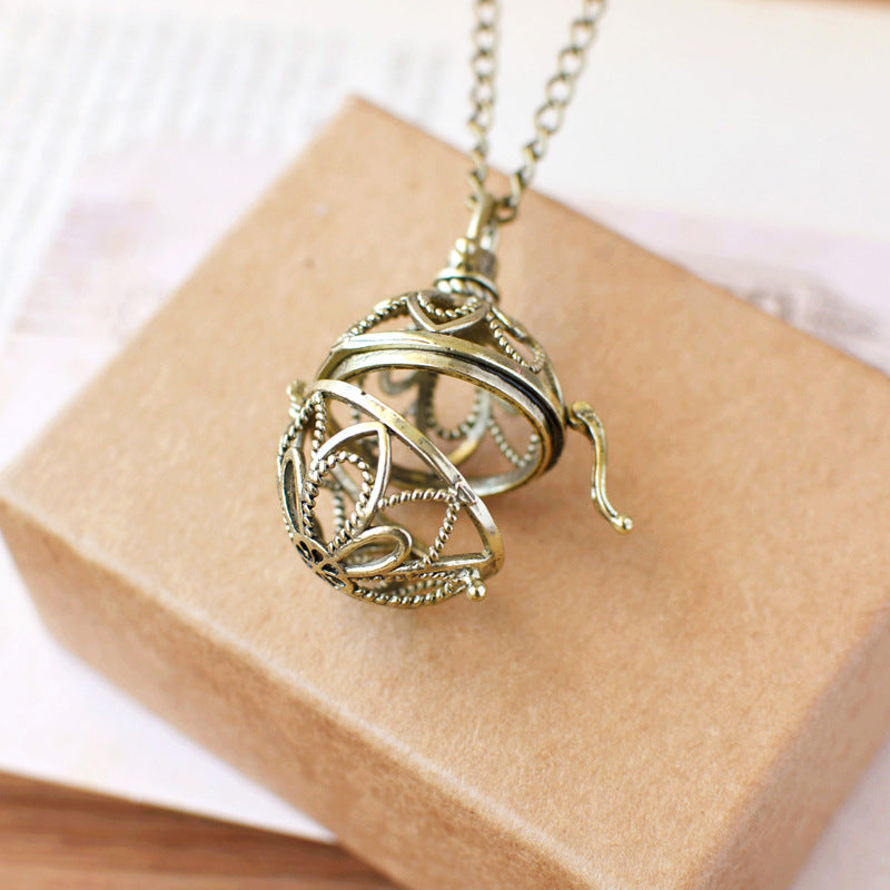Retro Artistic Hollowed-out Sachet Ball Pendant Necklace